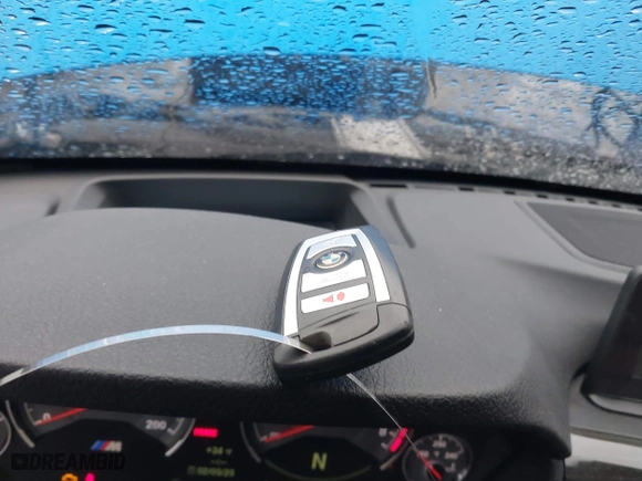 2015 BMW M4 with VIN WBS3U9C5XFJ968082, listed as a IAAI auction lot 41513593 with 57,715 mi miles. Bid and sale history available at carsss.com. Image 11.
