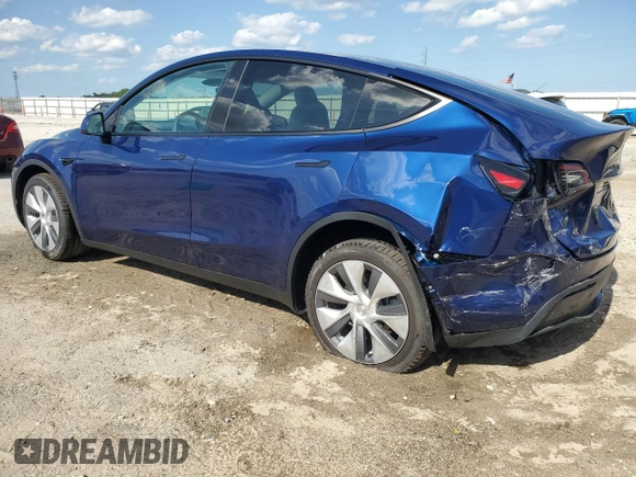 2023 Tesla Model Y Long Range z VIN 7SAYGDEE3PA178832, wystawiony jako Copart lot #57156005 z przebiegiem 12 920 mil mil oraz Szkoda całkowita • Salvage title. Historia ofert i sprzedaży dostępna na DreamBid. Obrazek 2.