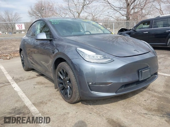 2021 Tesla Model Y Standard Range z VIN 5YJYGDED2MF118205, wystawiony jako IAAI lot #41785040 z przebiegiem 63 628 mil mil oraz . Historia ofert i sprzedaży dostępna na DreamBid. Obrazek 1.