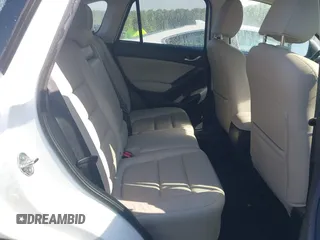 2014 Mazda CX-5 Grand Touring with VIN JM3KE2DY1E0424890, listed as a IAAI auction lot 42052437 with 107,793 mi miles. Bid and sale history available at carsss.com. Image 8.