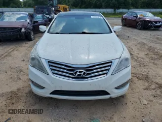 2013 Hyundai Azera z VIN KMHFH4JG4DA214345, wystawiony jako Copart lot #57491015 z przebiegiem 178 722 mil mil oraz Czysty tytuł • Clean title. Historia ofert i sprzedaży dostępna na DreamBid. Obrazek 6.