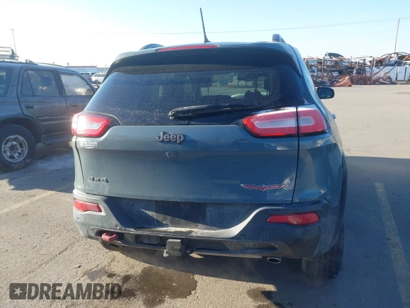 2015 Jeep Cherokee Trailhawk with VIN 1C4PJMBS3FW510219, listed as a IAAI auction lot 41440297 with 144,012 mi miles and . Bid and sale history available at DreamBid. Image 14.