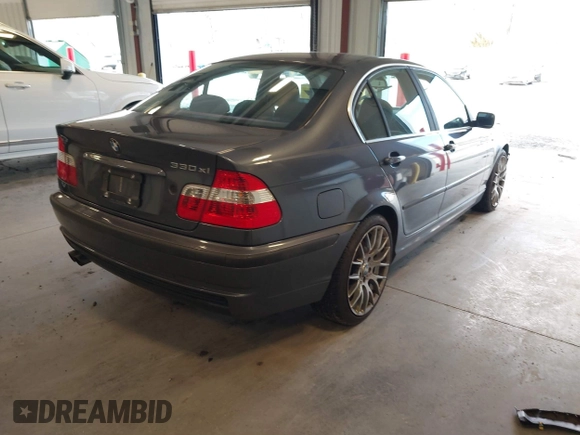 2003 BMW 3 Series 330xi with VIN WBAEW53463PG22999, listed as a IAAI auction lot 41596907 with 160,812 mi miles. Bid and sale history available at carsss.com. Image 4.