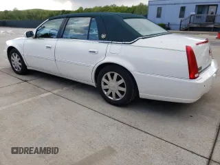 2006 Cadillac DTS 1SD z VIN 1G6KD57Y86U146074, wystawiony jako Copart lot #52917235 z przebiegiem 133 956 mil mil oraz Tytuł czysty. Historia ofert i sprzedaży dostępna na DreamBid. Obrazek 2.