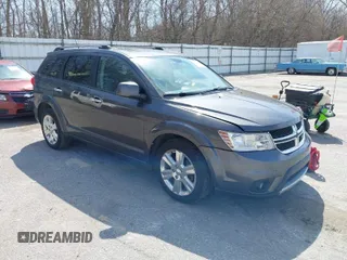 2014 Dodge Journey Limited with VIN 3C4PDDDG7ET138601, listed as a IAAI auction lot 42021766 with 214,220 mi miles and . Bid and sale history available at carsss.com. Image 1.