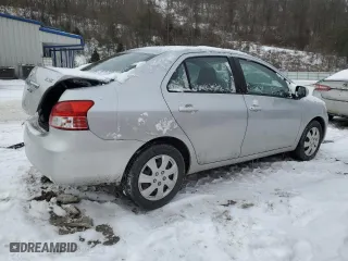 2011 Toyota Yaris with VIN JTDBT4K37B1401590, listed as a Copart auction lot 46142555 with 165,082 mi miles and Salvage Title. Bid and sale history available at carsss.com. Image 3.