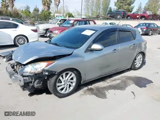2012 Mazda Mazda3 i Touring with VIN JM1BL1L89C1558242, listed as a IAAI auction lot 42057513 with 112,094 mi miles. Bid and sale history available at carsss.com. Image 2.