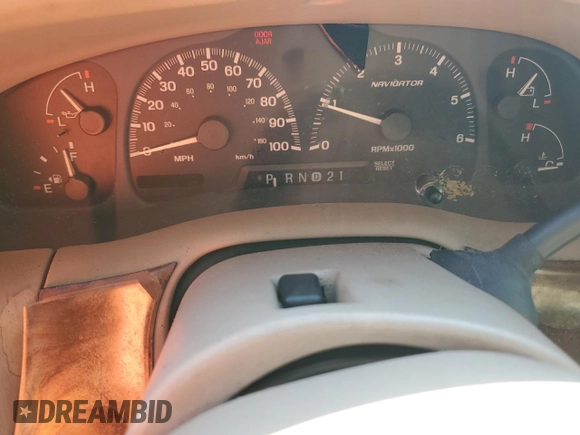 1999 Lincoln Navigator z VIN 5LMRU27A2XLJ41370, wystawiony jako Copart lot #72879004 z przebiegiem Nie podano mil oraz Szkoda całkowita • Salvage title. Historia ofert i sprzedaży dostępna na DreamBid. Obrazek 9.