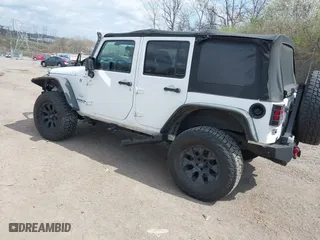 2012 Jeep Wrangler Unlimited Sahara with VIN 1C4BJWEG9CL220965, listed as a IAAI auction lot 41902295 with 120,492 mi miles. Bid and sale history available at carsss.com. Image 3.