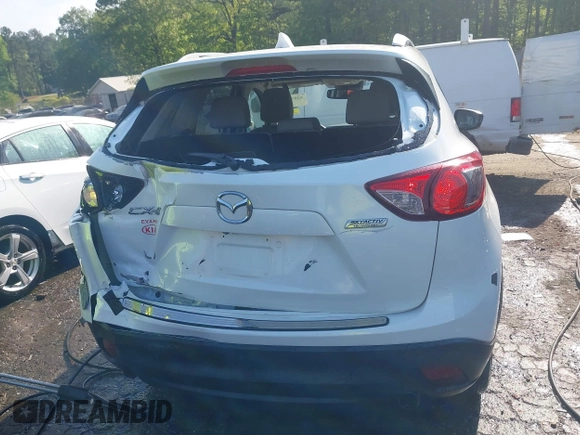 2014 Mazda CX-5 Grand Touring with VIN JM3KE2DY1E0424890, listed as a IAAI auction lot 42052437 with 107,793 mi miles. Bid and sale history available at carsss.com. Image 16.