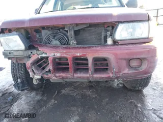 2002 Isuzu Rodeo with VIN 4S2DM58W124319936, listed as a IAAI auction lot 41555285 with 143,035 mi miles. Bid and sale history available at carsss.com. Image 6.