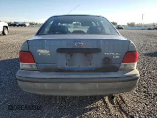 1999 Toyota Tercel z VIN JT2BC53L9X0354072, wystawiony jako Copart lot #73050384 z przebiegiem 163 566 mil mil oraz Szkody całkowita. Historia ofert i sprzedaży dostępna na DreamBid. Obrazek 6.