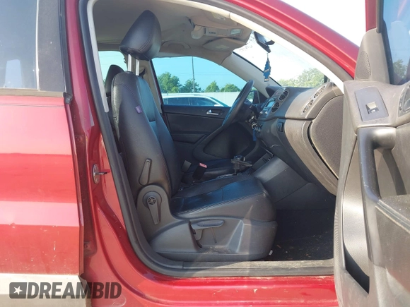 2011 Volkswagen Tiguan SEL w/Premium Navi with VIN WVGAV7AX4BW001402, listed as a IAAI auction lot 42406619 with 183,035 mi miles and . Bid and sale history available at DreamBid. Image 5.