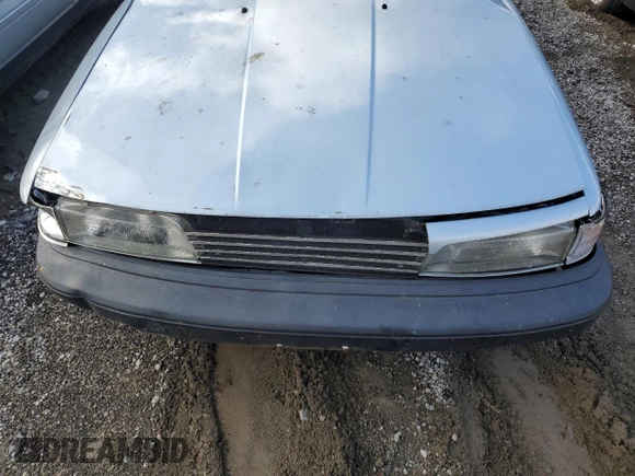 1990 Toyota Camry DLX z VIN 4T1SV21E8LU165609, wystawiony jako Copart lot #79314534 z przebiegiem 153 006 mil mil oraz Szkoda całkowita • Salvage title. Historia ofert i sprzedaży dostępna na DreamBid. Obrazek 11.