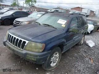 2003 Jeep Grand Cherokee Laredo with VIN 1J4GW48S63C591605, listed as a IAAI auction lot 41973681 with 177,024 mi miles. Bid and sale history available at carsss.com. Image 2.