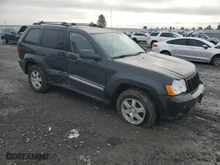 2010 Jeep Grand Cherokee Laredo with VIN 1J4RR4GT7AC120604, listed as a Copart auction lot 84257724 with 60,827 mi miles and Salvage Title. Bid and sale history available at carsss.com. Image 4.