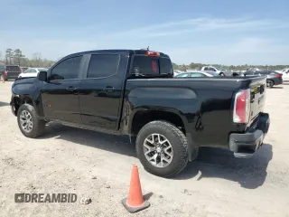 2021 GMC Canyon 4WD AT4 w/Leather with VIN 1GTG6FEN3M1274409, listed as a Copart auction lot 49228145 with 57,194 mi miles and Salvage Title. Bid and sale history available at carsss.com. Image 2.