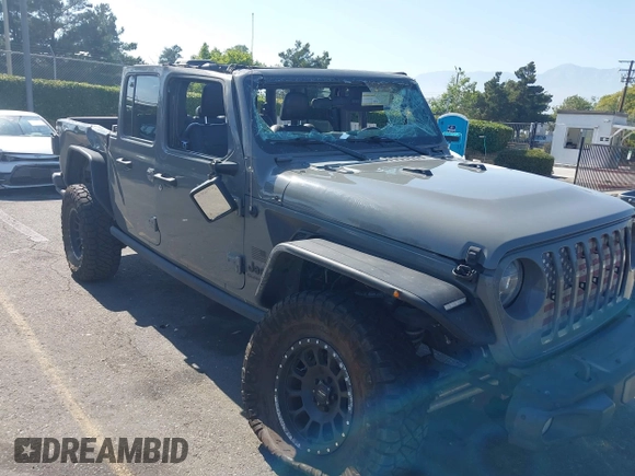 2021 Jeep Gladiator 80th Anniversary z VIN 1C6HJTAG7ML564981, wystawiony jako IAAI lot #42455062 z przebiegiem 89 721 mil mil oraz . Historia ofert i sprzedaży dostępna na DreamBid. Obrazek 6.