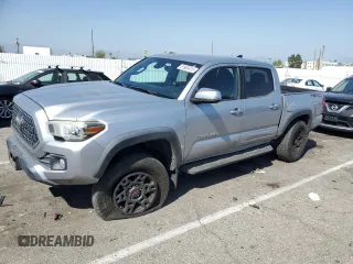 2018 Toyota Tacoma SR5 с VIN 3TMAZ5CN3JM059802, выставлен на аукционе Copart как лот 51863415 с пробегом 198 170 миль миль и Списание • Salvage title. История ставок и продаж доступна на DreamBid. Изображение 1.