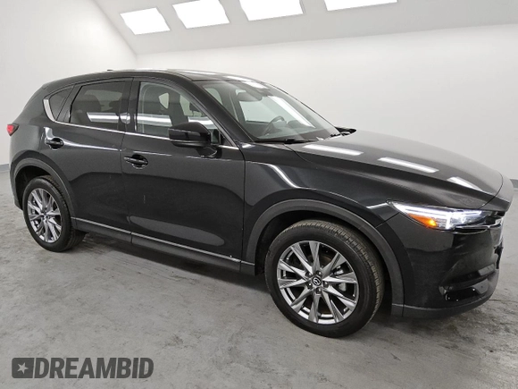 2021 Mazda CX-5 Grand Touring with VIN JM3KFBDM6M0487606, listed as a Copart auction lot 45399655 with 25,241 mi miles and Clean Title. Bid and sale history available at DreamBid. Image 4.
