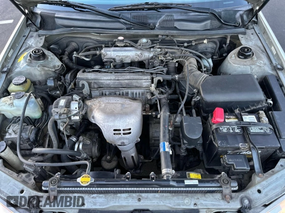 2000 Toyota Camry CE z VIN 4T1BG22K2YU669871, wystawiony jako Copart lot #57918075 z przebiegiem 164 842 mil mil oraz Czysty tytuł • Clean title. Historia ofert i sprzedaży dostępna na DreamBid. Obrazek 7.