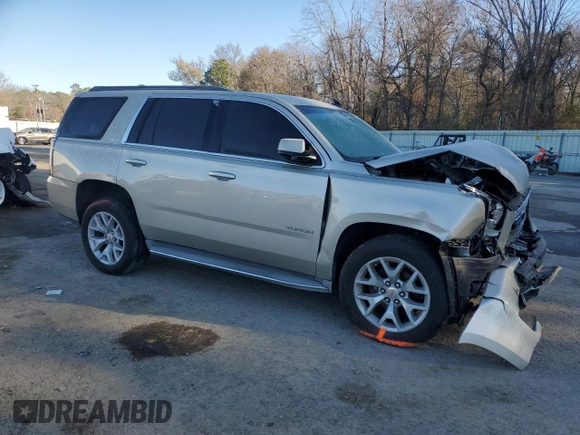 2015 GMC Yukon SLE with VIN 1GKS1AKC4FR265208, listed as a Copart auction lot 42324245 with 105,760 mi miles and Salvage Title. Bid and sale history available at carsss.com. Image 4.