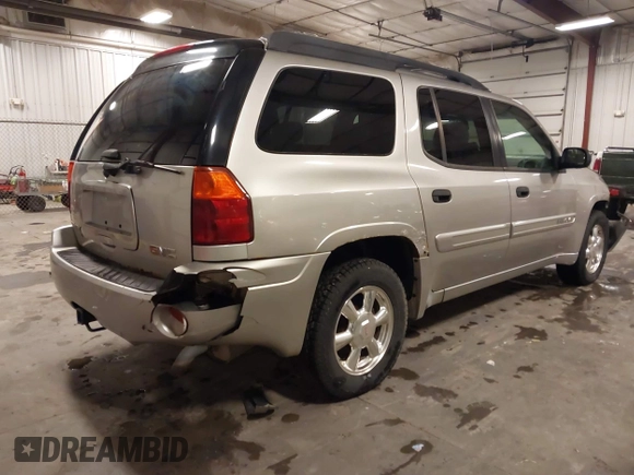 2005 GMC Envoy SLE with VIN 1GKET16S656102522, listed as a IAAI auction lot 41729310 with 233,049 mi miles. Bid and sale history available at carsss.com. Image 4.