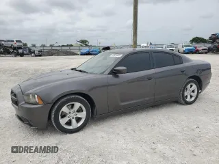2014 Dodge Charger SXT z VIN 2C3CDXHG9EH318671, wystawiony jako Copart lot #59961825 z przebiegiem 143 899 mil mil oraz Czysty tytuł • Clean title. Historia ofert i sprzedaży dostępna na DreamBid. Obrazek 1.