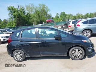 2015 Honda Fit LX z VIN 3HGGK5H51FM724566, wystawiony jako IAAI lot #42151755 z przebiegiem 168 744 mil mil oraz . Historia ofert i sprzedaży dostępna na DreamBid. Obrazek 13.