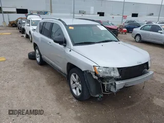 2011 Jeep Compass with VIN 1J4NT1FA7BD142600, listed as a IAAI auction lot 41590661 with 266,600 mi miles. Bid and sale history available at carsss.com. Image 1.