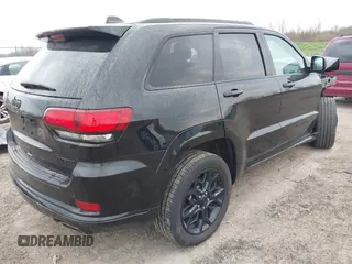 2021 Jeep Grand Cherokee 80th Anniversary with VIN 1C4RJFBG7MC828116, listed as a IAAI auction lot 42118355 with 57,240 mi miles and . Bid and sale history available at DreamBid. Image 4.