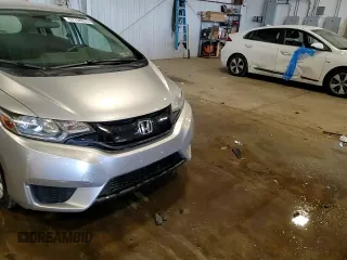 2016 Honda Fit LX z VIN JHMGK5H50GX026653, wystawiony jako Copart lot #57766675 z przebiegiem 68 656 mil mil oraz Szkody całkowita. Historia ofert i sprzedaży dostępna na DreamBid. Obrazek 13.