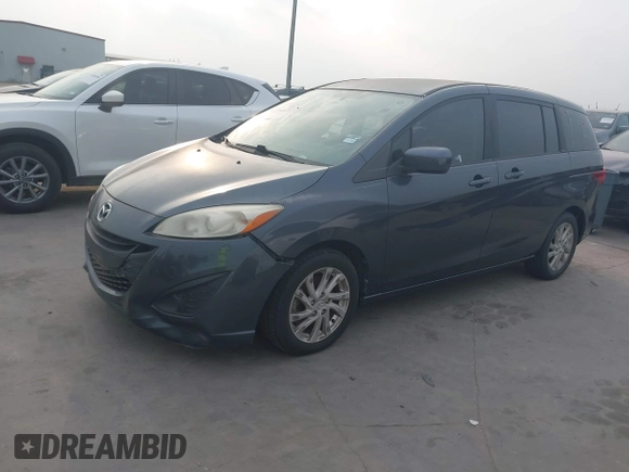 2012 Mazda 5 Sport with VIN JM1CW2BL6C0134921, listed as a IAAI auction lot 42290476 with 128,490 mi miles and . Bid and sale history available at DreamBid. Image 2.