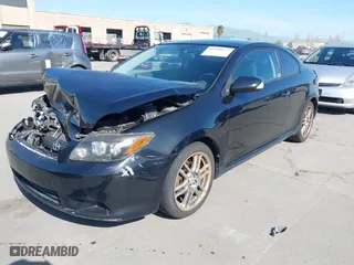 2008 Scion tC Spec with VIN JTKDE167580234717, listed as a IAAI auction lot 41980475 with 164,163 mi miles. Bid and sale history available at carsss.com. Image 2.