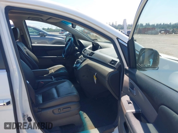 2012 Honda Odyssey EX-L with VIN 5FNRL5H61CB019215, listed as a IAAI auction lot 41837320 with 248,498 mi miles and . Bid and sale history available at DreamBid. Image 5.