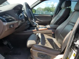 2012 BMW X5 35i with VIN 5UXZV4C54CL744502, listed as a Copart auction lot 57828115 with 161,597 mi miles and Clean title. Bid and sale history available at DreamBid. Image 7.