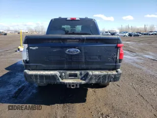 2023 Ford F-150 Lightning Pro with VIN 1FT6W1EV4PWG24488, listed as a Copart auction lot 51523945 with Not provided miles and Salvage title. Bid and sale history available at DreamBid. Image 6.