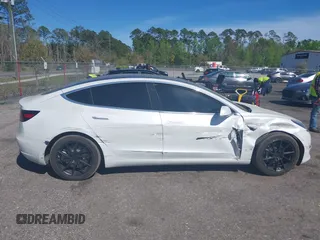 2019 Tesla Model 3 Mid Range with VIN 5YJ3E1EA7KF425127, listed as a IAAI auction lot 41886436 with 87,236 mi miles and . Bid and sale history available at carsss.com. Image 13.