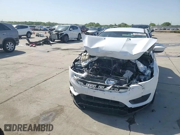 2018 Ford Focus SE z VIN 1FADP3F29JL225126, wystawiony jako Copart lot #52817265 z przebiegiem Nie podano mil oraz Szkoda całkowita • Salvage title. Historia ofert i sprzedaży dostępna na DreamBid. Obrazek 13.