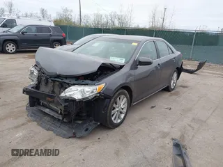 2014 Toyota Camry L with VIN 4T4BF1FK6ER364253, listed as a IAAI auction lot 42011773 with 87,051 mi miles. Bid and sale history available at carsss.com. Image 2.