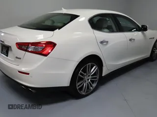 2014 Maserati Ghibli S Q4 z VIN ZAM57RTA7E1094580, wystawiony jako Copart lot #58866195 z przebiegiem 79 463 mil mil oraz Szkody całkowita. Historia ofert i sprzedaży dostępna na DreamBid. Obrazek 3.