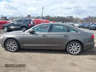 2013 Audi A6 Premium Plus z VIN WAUGGAFC1DN038375, wystawiony jako IAAI lot #42051929 z przebiegiem 118 181 mil mil oraz . Historia ofert i sprzedaży dostępna na DreamBid. Obrazek 17.