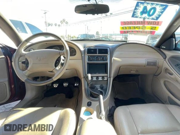2004 Ford Mustang GT Deluxe z VIN 1FAFP45XX4F150757, wystawiony jako Copart lot #51550375 z przebiegiem 43 827 mil mil oraz Tytuł czysty. Historia ofert i sprzedaży dostępna na DreamBid. Obrazek 9.