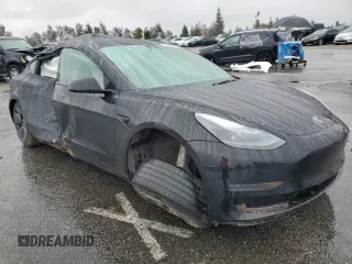 2023 Tesla Model 3 with VIN 5YJ3E1EA2PF671865, listed as a Copart auction lot 45220285 with 29,614 mi miles and Salvage title. Bid and sale history available at DreamBid. Image 4.