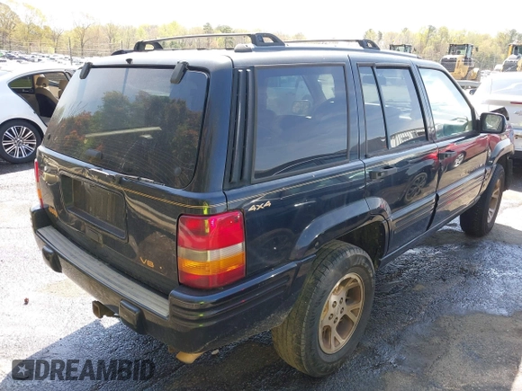 1997 Jeep Grand Cherokee Limited with VIN 1J4GZ78Y1VC658515, listed as a IAAI auction lot 41897266 with 164,033 mi miles and . Bid and sale history available at DreamBid. Image 4.