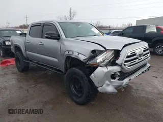 2018 Toyota Tacoma SR with VIN 5TFGZ5AN4JX142565, listed as a IAAI auction lot 41353718 with 87,544 mi miles and . Bid and sale history available at carsss.com. Image 1.