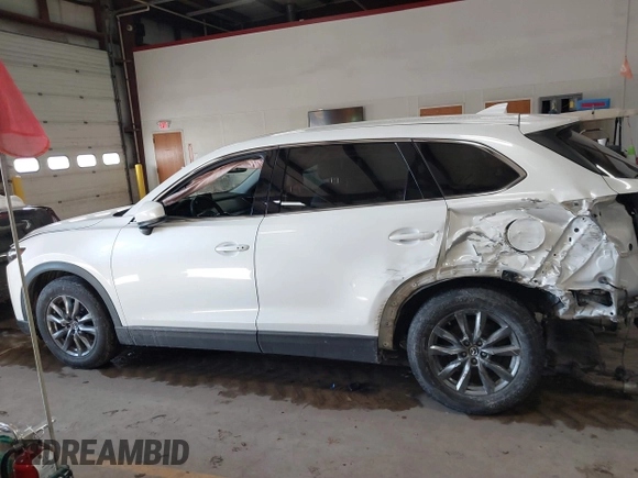 2020 Mazda CX-9 Touring z VIN JM3TCBCY8L0405360, wystawiony jako IAAI lot #41419428 z przebiegiem 69 917 mil mil oraz . Historia ofert i sprzedaży dostępna na DreamBid. Obrazek 14.