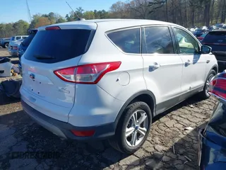 2016 Ford Escape SE with VIN 1FMCU0G97GUA80692, listed as a IAAI auction lot 41860124 with 122,251 mi miles. Bid and sale history available at carsss.com. Image 4.