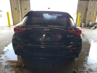2018 Infiniti QX30 Premium with VIN SJKCH5CP8JA041948, listed as a Copart auction lot 53582513 with 56,915 mi miles and Salvage title. Bid and sale history available at DreamBid. Image 6.
