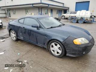 2003 Hyundai Tiburon GT z VIN KMHHN65F13U068658, wystawiony jako Copart lot #81799404 z przebiegiem 163 148 mil mil oraz Szkoda całkowita • Salvage title. Historia ofert i sprzedaży dostępna na DreamBid. Obrazek 4.
